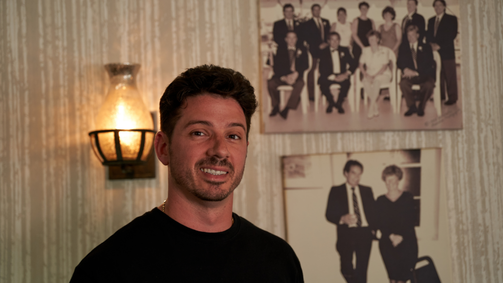 Danny Napolitano picture with wall frames of family pictures 
