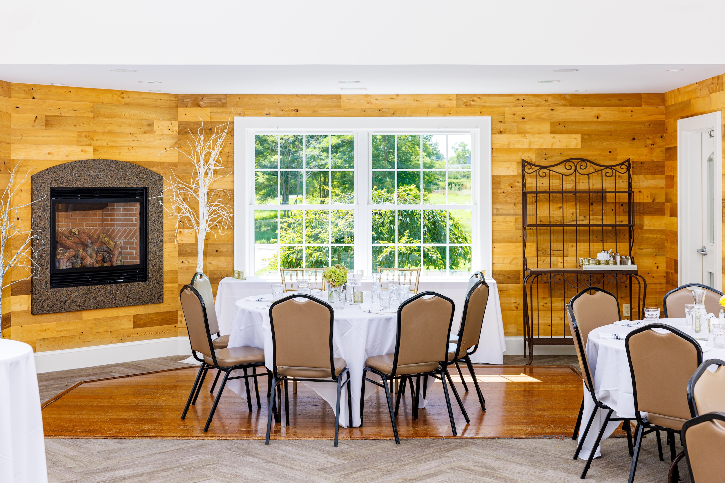 The fireplace and a table in our Ocean Star banquet room