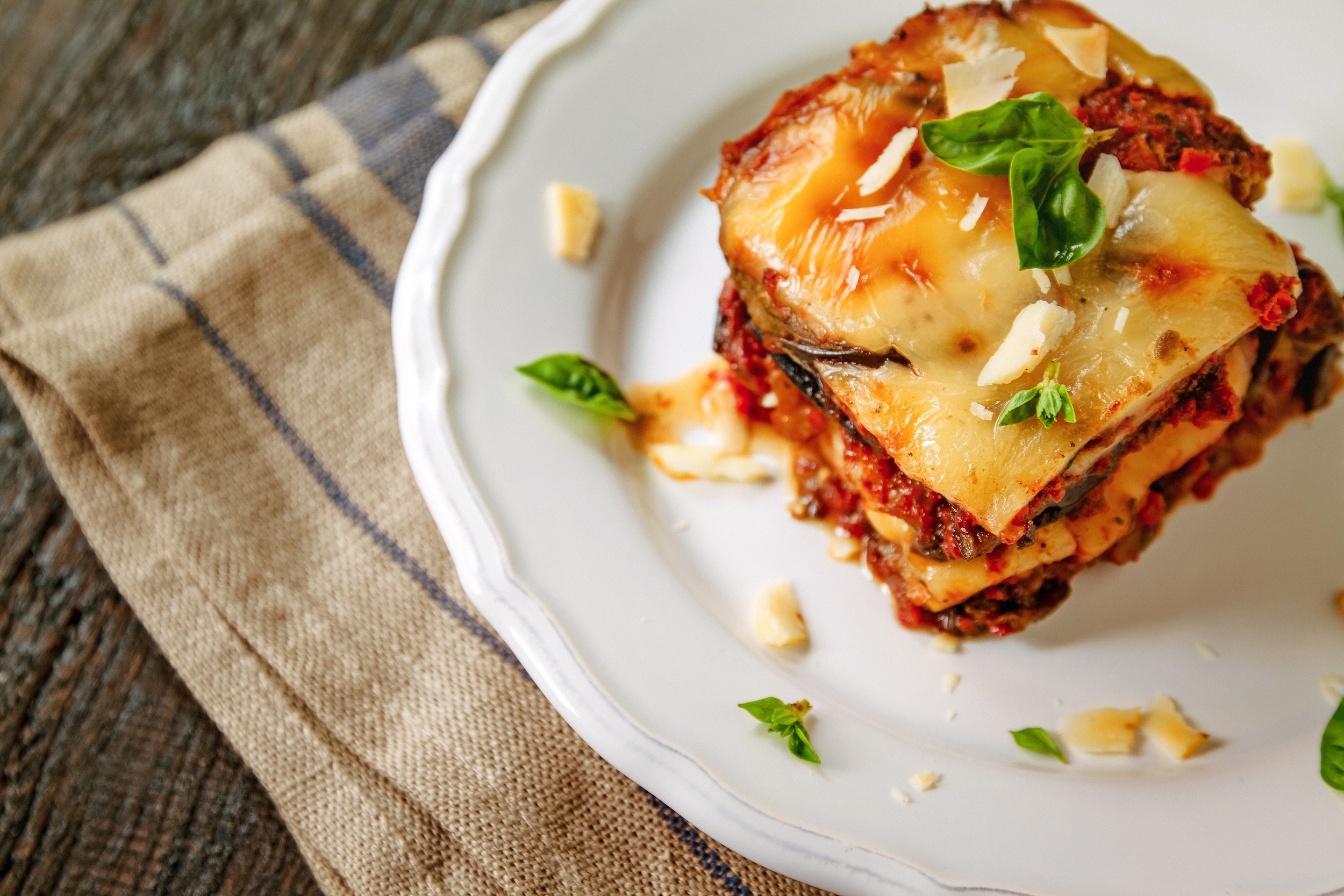 a piece of eggplant parm on a plate